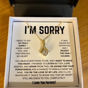 New in box “I’M SORRY” necklace cubic zirconia pendant with gold tone chain 17”
